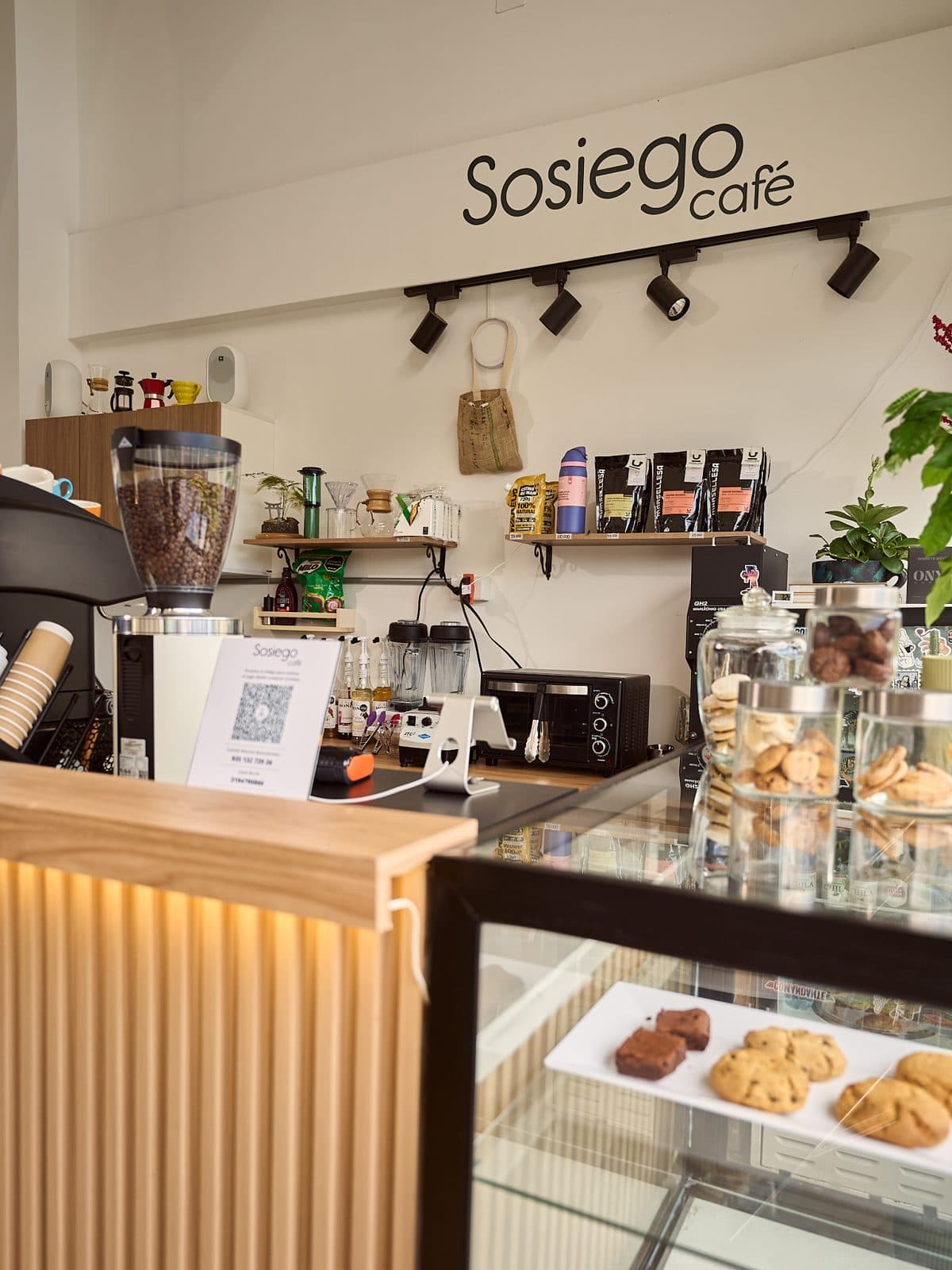 The Sosiego Café counter, with the display case of cookies and brownies